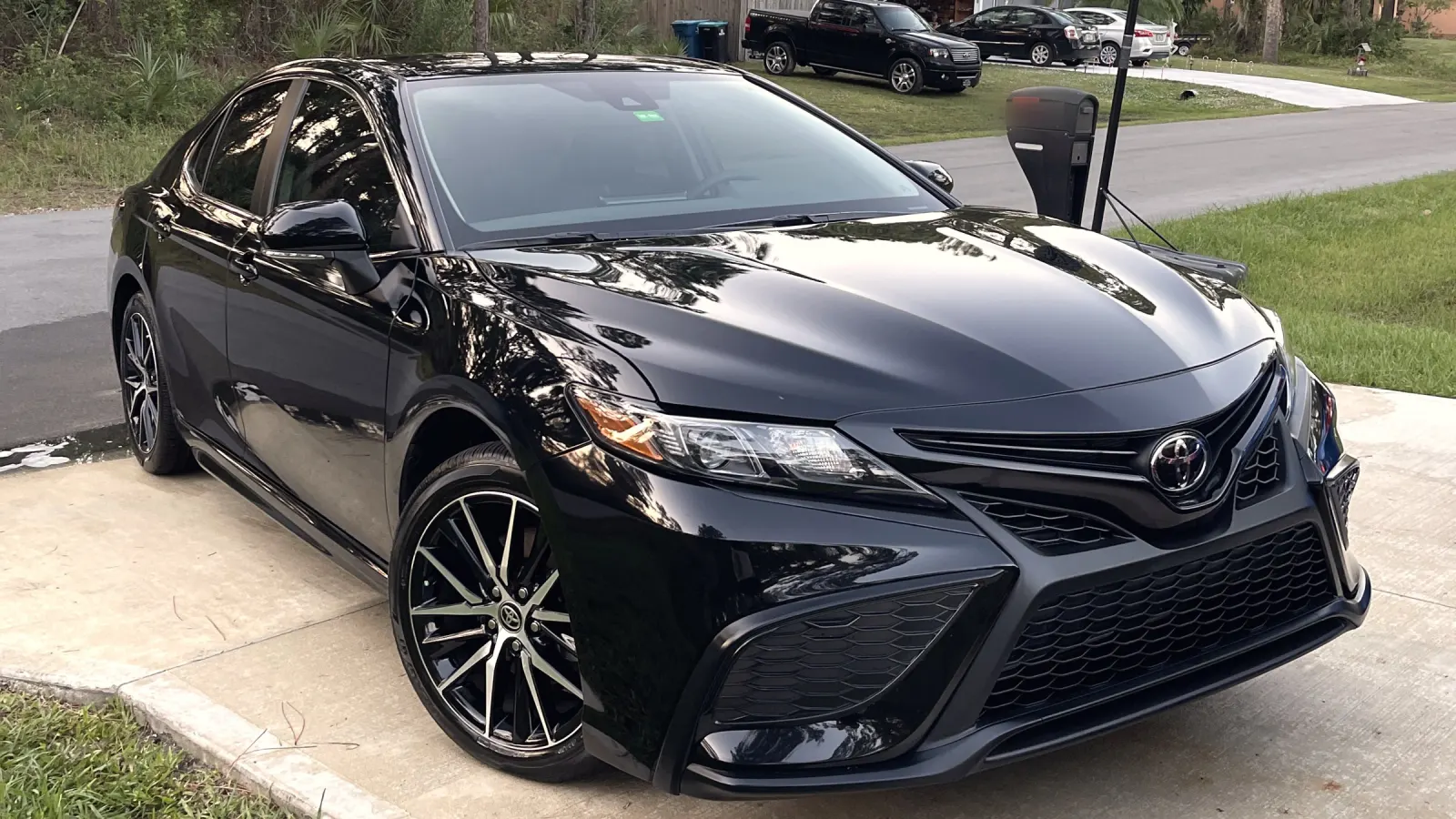 Black Toyota Camry with a fresh gloss finish after a detail