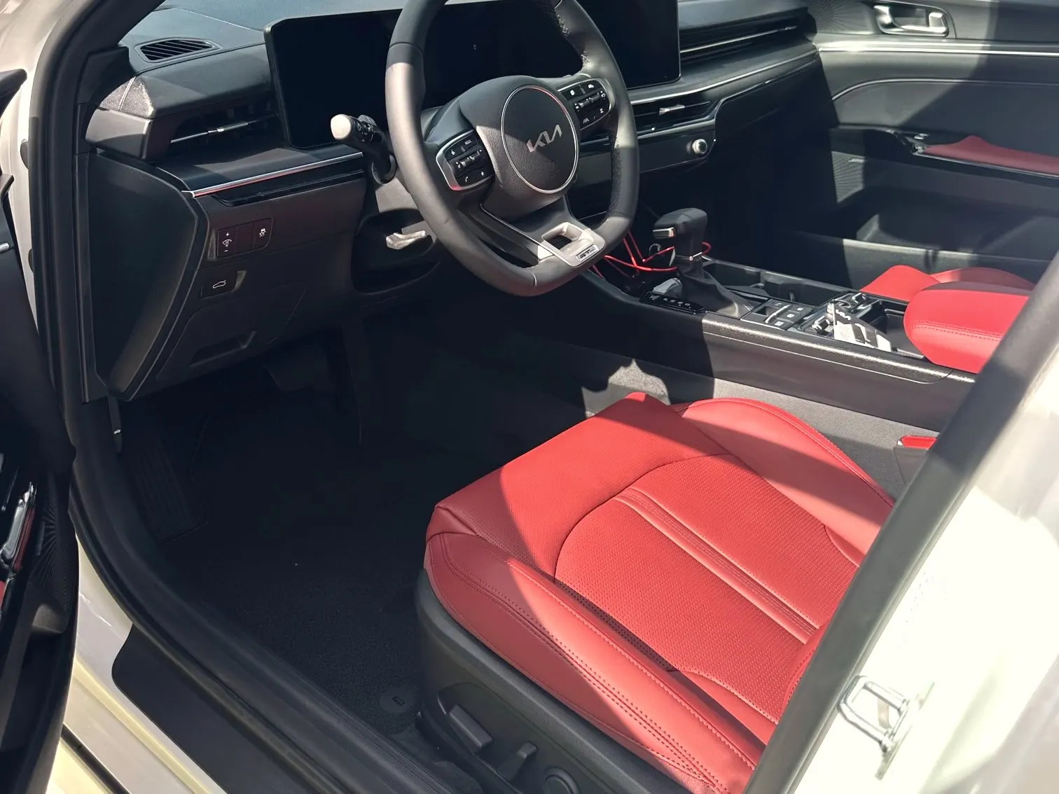 Red leather front seats and dashboard after an interior detail