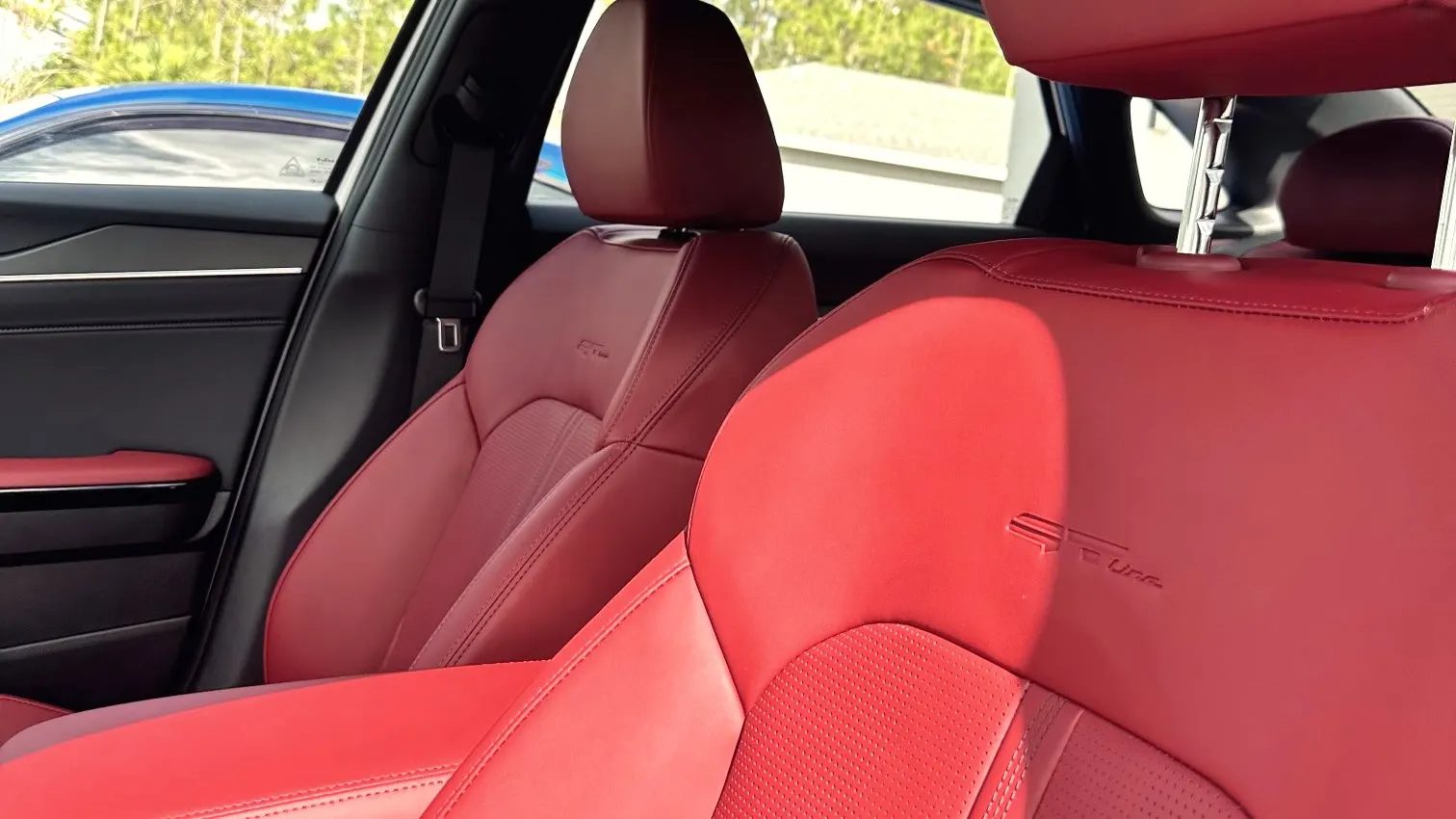 Red leather seats after an interior deep clean